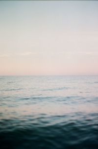 Scenic view of sea against clear sky during sunset