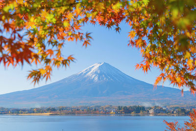 Scenic view of snowcapped mountains against sky during autumn