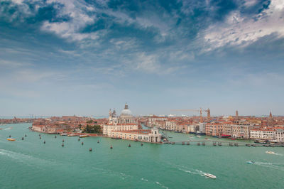 Aerial view of giudecca channel and canal grande with boat deck, venice, italy