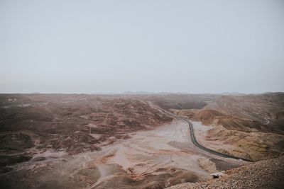 Scenic view of desert against clear sky