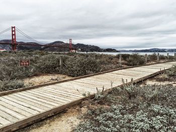 Walkway against sky