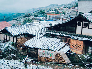 High angle view of snow on houses during winter