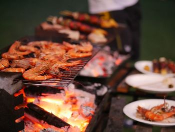 Close-up of meat on barbecue grill