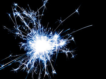 Close-up of firework display against black background