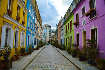 Alley amidst buildings in city