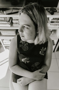 Portrait of girl sitting at home