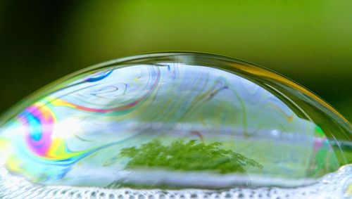 Close-up of bubbles in glass on table