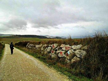 View of landscape against cloudy sky