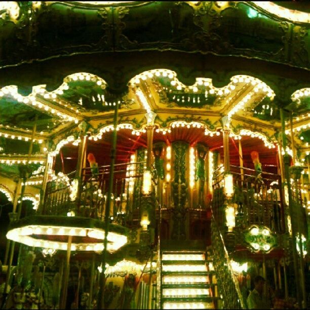 illuminated, night, amusement park, arts culture and entertainment, decoration, tree, celebration, lighting equipment, carousel, incidental people, amusement park ride, multi colored, hanging, outdoors, tradition, low angle view, christmas, in a row, christmas lights, no people