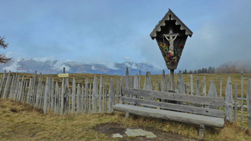 Built structure on field against sky