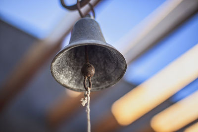 Low angle view of lamp post against blurred background