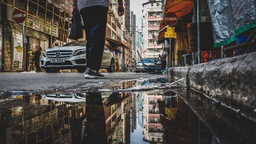 Reflection of buildings in puddle