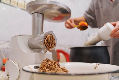 Meat grinder at home kitchen. lifestyle photography. food preparing