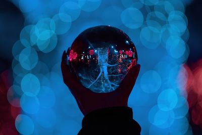 Crystal ball reflection of christmas market