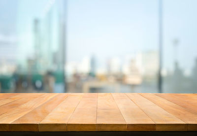Wooden table against clear sky
