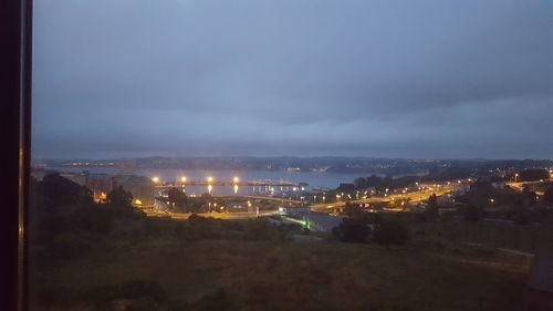 High angle view of city against cloudy sky