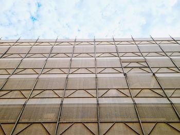 Low angle view of building against cloudy sky