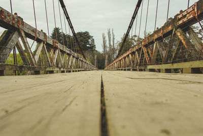 Surface level of bridge against sky