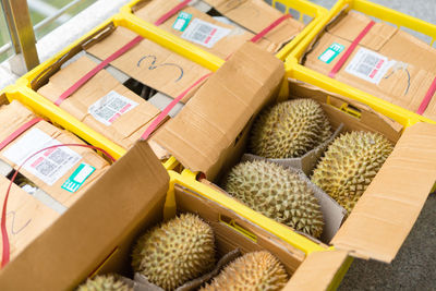 High angle view of fruits in boxes for sale at market