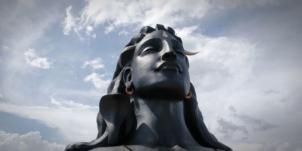 Low angle view of statue against sky