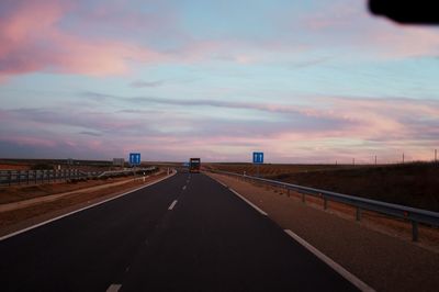 Highway against sky during sunset