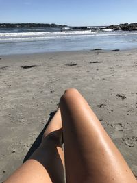 Low section of woman on beach