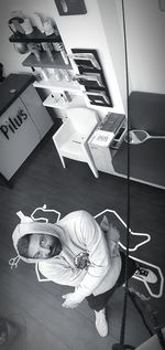 High angle portrait of man sitting at home