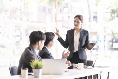 Colleagues working at office