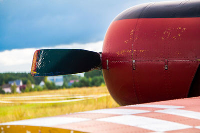 Vintage aircraft preparing for take-off on the background of a stormy sky