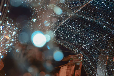 Low angle view of illuminated christmas lights