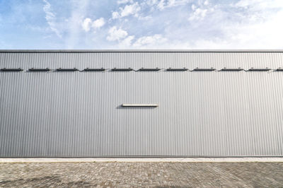 Low angle view of metal structure against sky