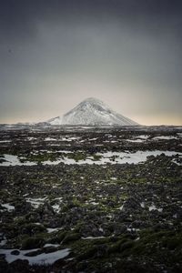 Scenic view of snow covered mountain against sky