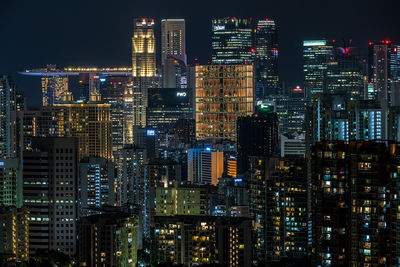Illuminated buildings in city at night