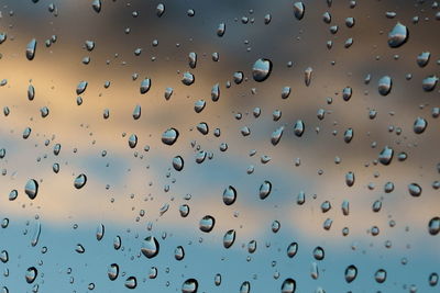 Full frame shot of wet glass window