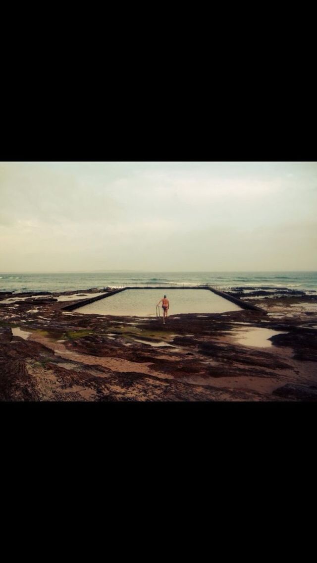 sea, horizon over water, sky, beach, built structure, architecture, water, silhouette, copy space, cloud - sky, tranquility, railing, tranquil scene, nature, day, sunlight, auto post production filter, shore, scenics