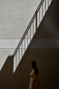 Shadow of woman on staircase