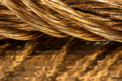 Close-up of copper on table with reflection