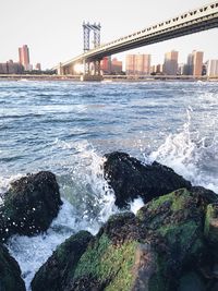 View of suspension bridge over sea