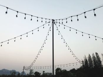 Low angle view of silhouette birds against clear sky