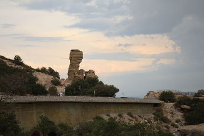 Built structure against cloudy sky