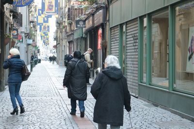 People walking on street in city