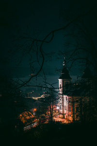 Illuminated building against sky at night