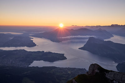 Scenic view of mountains against sky during sunset