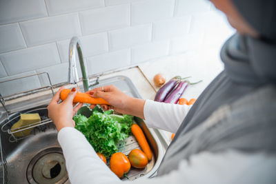 Midsection of woman holding food