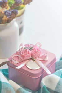 A pink gift box on the table