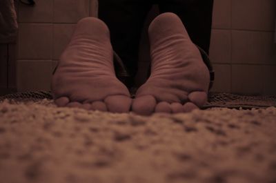 Low section of people relaxing on floor