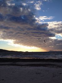 Scenic view of sea against cloudy sky