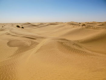 Scenic view of desert against clear sky