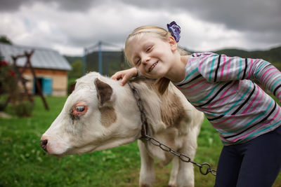 Smiling girl looking away on field