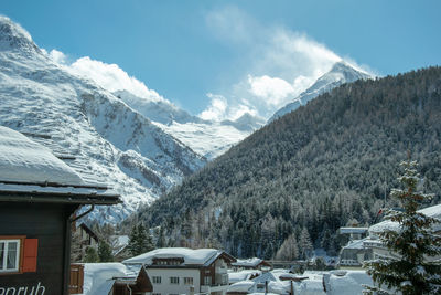 Scenic view of snowcapped mountains against sky